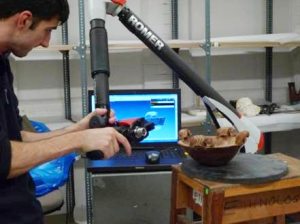 Laser scanner mounted on an arm scans a bowl from the Egyptology collection